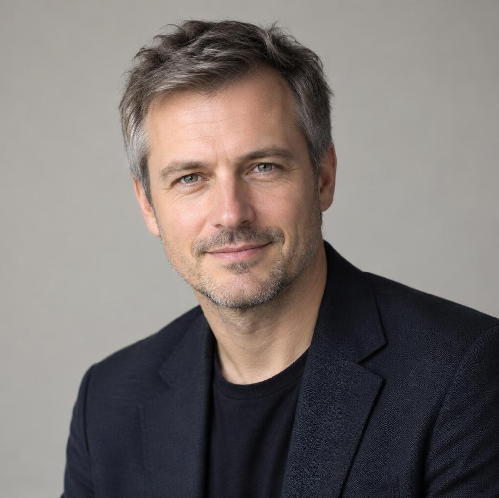 Portrait of a man in a dark blazer